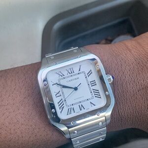 Cartier Silver Timepiece with White Face